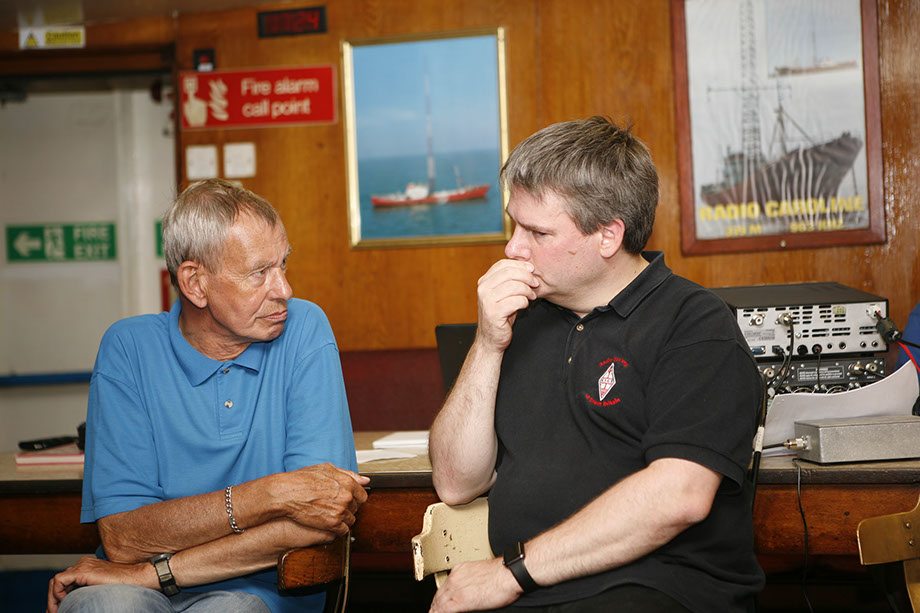 Bill Rollins, G1WJR and Pete Sipple, M0PSX chatting in the mess of MV Ross Revenge.